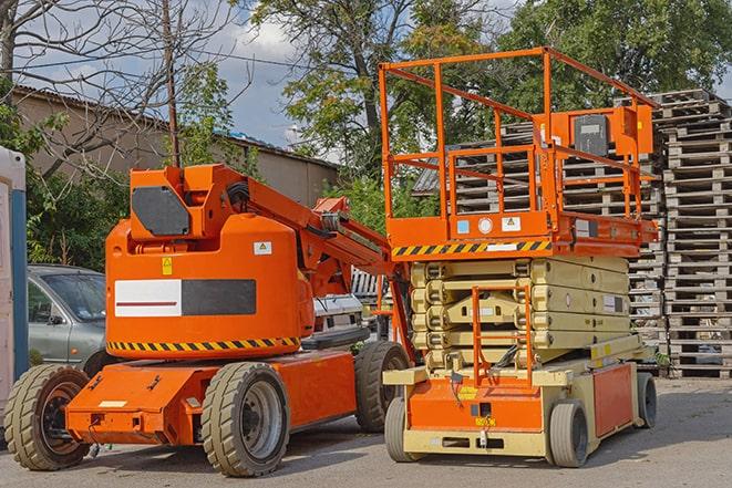 forklift carrying heavy pallets in warehouse in Deerfield NY